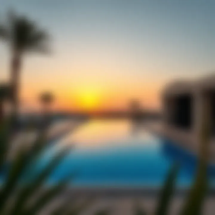 View of a villa’s private pool during sunset